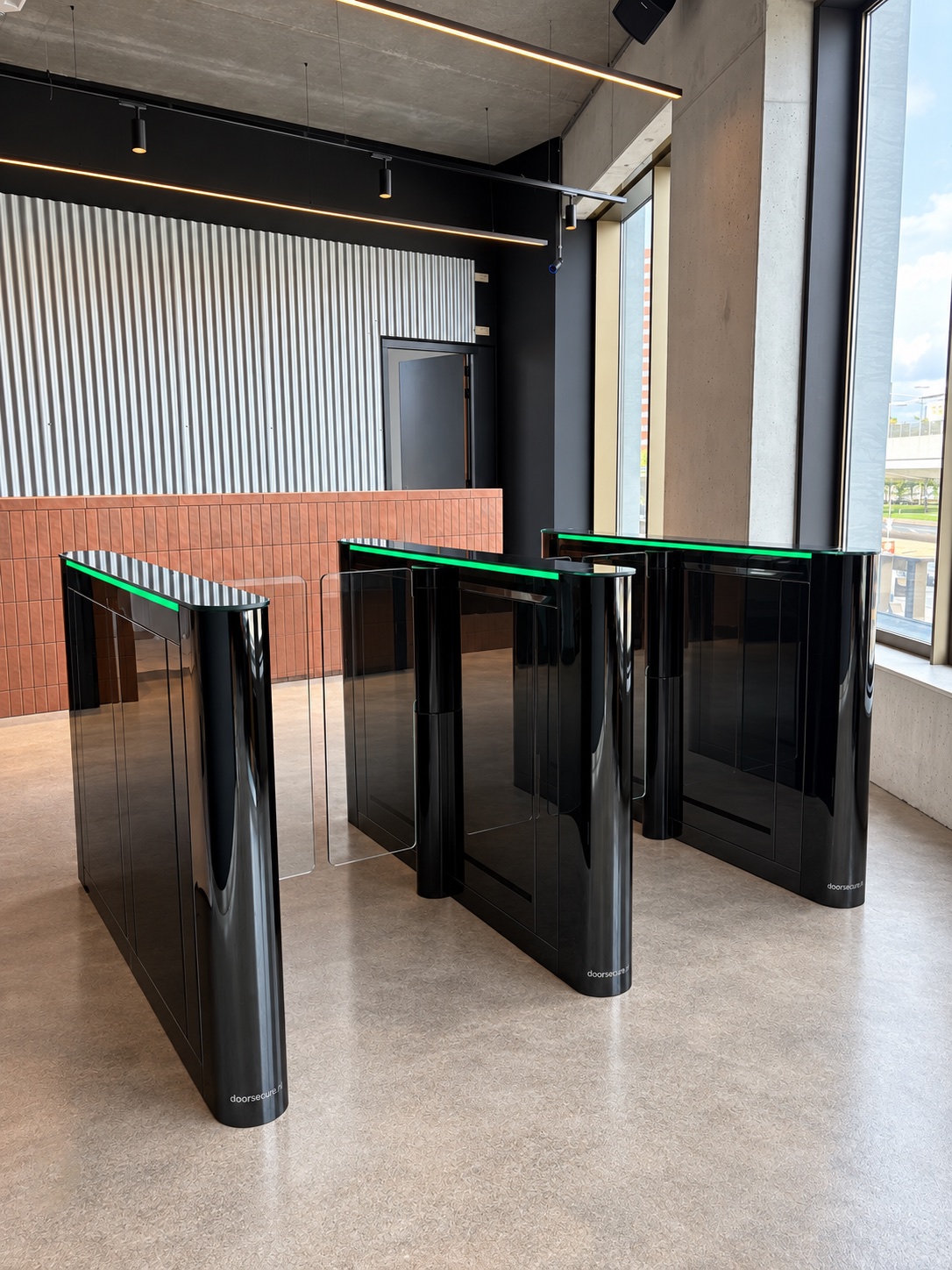 Black Doorsecure speed gates with clear glass wings
